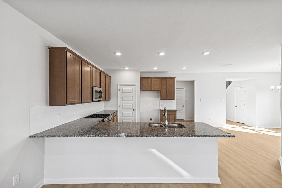 The Sparrow II- Breakfast Area into Kitchen and Dining Room