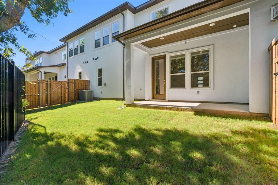 Covered patio and fenced yard.