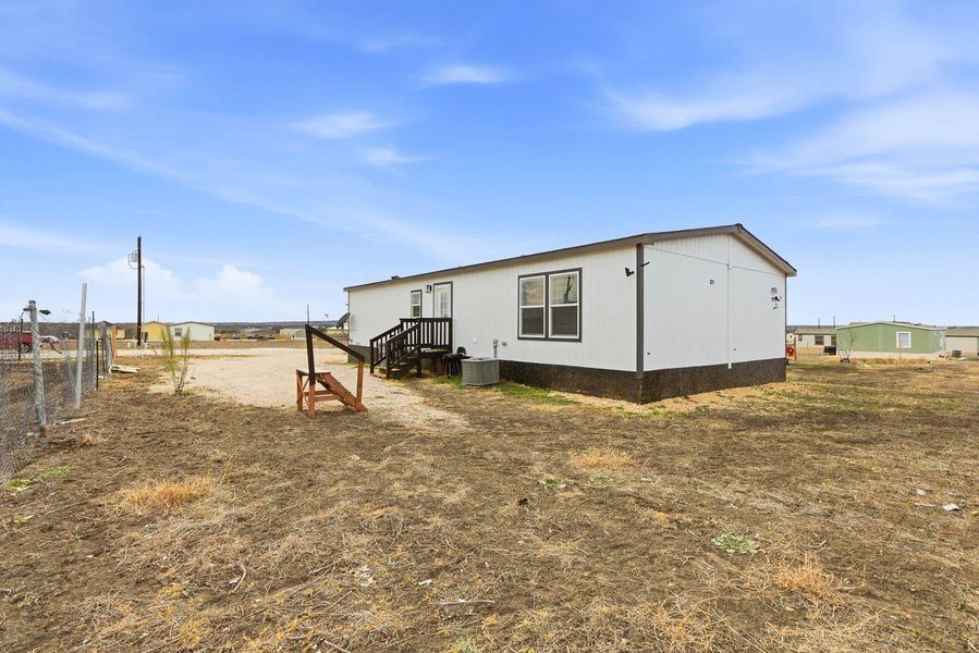 View of home's exterior featuring a central AC unit