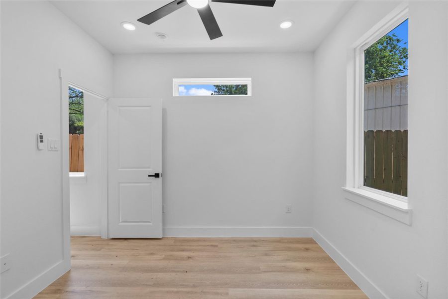 Bedroom retreat suit featuring oversized windows, warm wood-tone flooring and abundant natural light on the first floor Bedroom retreat suit featuring oversized windows, warm wood-tone flooring and abundant natural light on the first floor