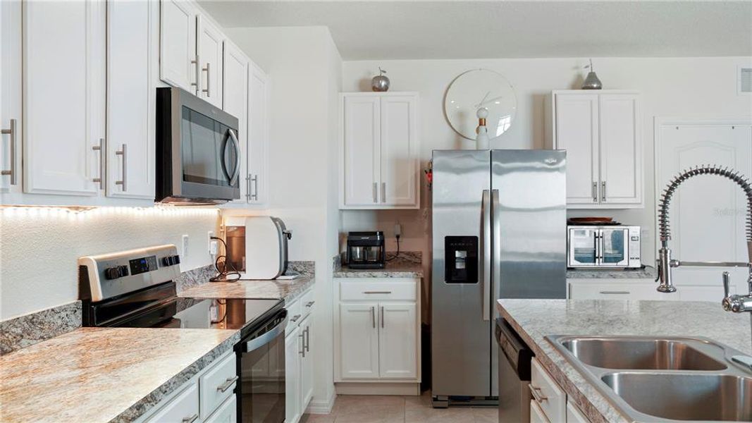 Furnished interior view inside a new home in Charles Cove Express, Davenport (Image 3).