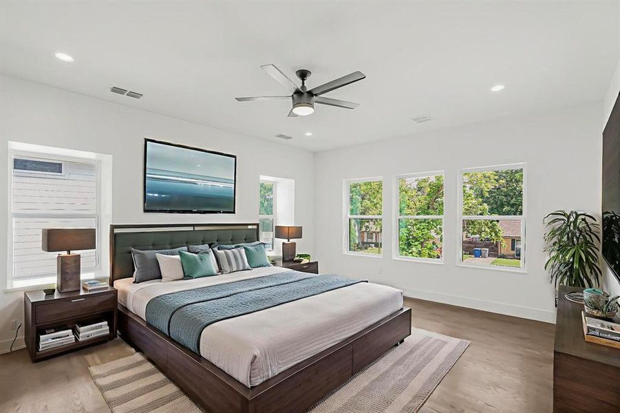 Bedroom featuring light wood-style floors, a ceiling fan, and recessed lighting