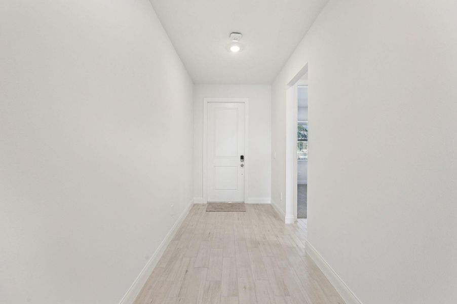 Spacious, unfurnished interior of a new home in Brystol at Wylder - Reserve Series, Port St. Lucie (Image 15).