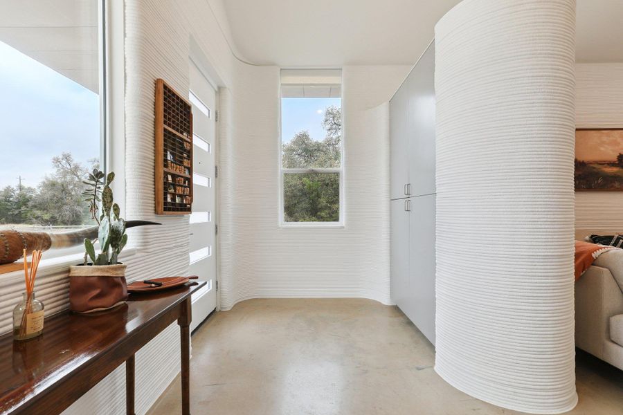 Corridor featuring finished concrete flooring