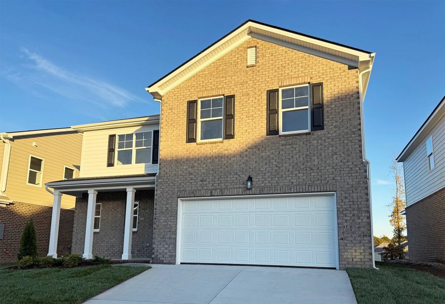 Front exterior of a new home in Cades Bluff, Lebanon, TN, highlighting curb appeal (Image 2). Front exterior of a new home in Cades Bluff, Lebanon, TN, highlighting curb appeal (Image 2).