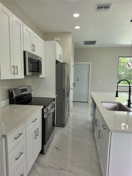Furnished interior view inside a new home in , Lehigh Acres (Image 7).