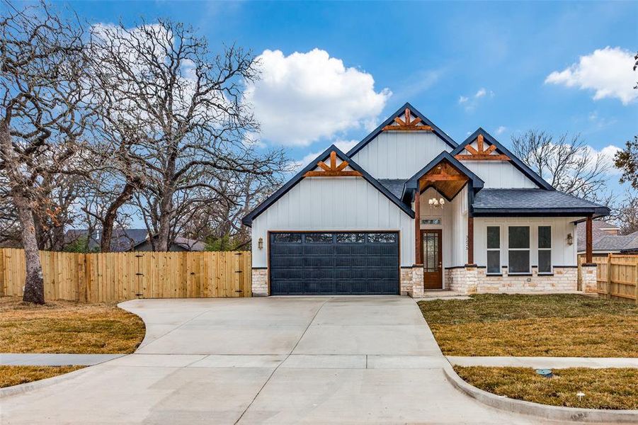 View of front facade with a garage and a front yard