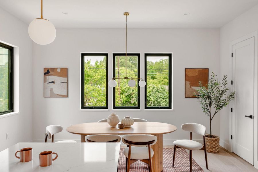 Dining space with light wood-style floors Dining space with light wood-style floors
