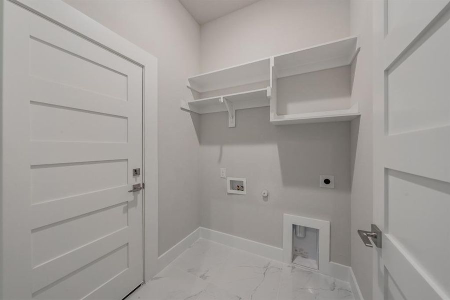 Laundry room featuring gas dryer hookup, light marble finish flooring, washer hookup, and electric dryer hookup