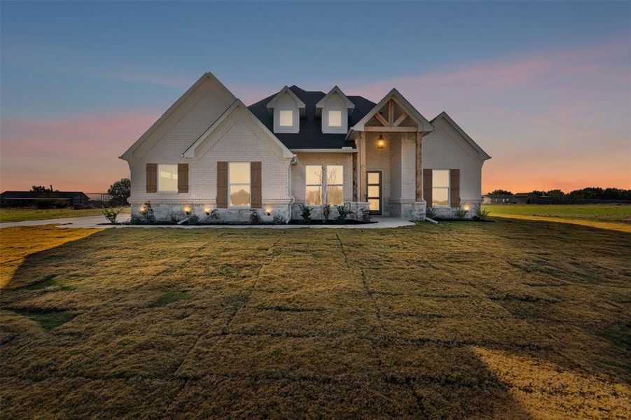 View of front of house featuring a yard