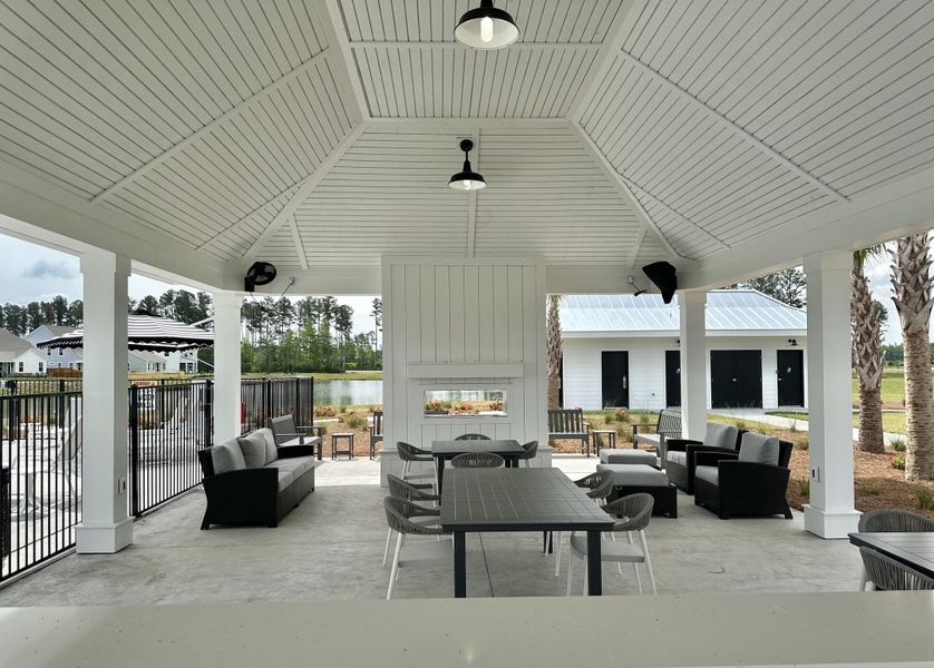 Exterior details and patio area of a home in Summerwind Crossing at Lakes of Cane Bay, Summerville (Image 33).