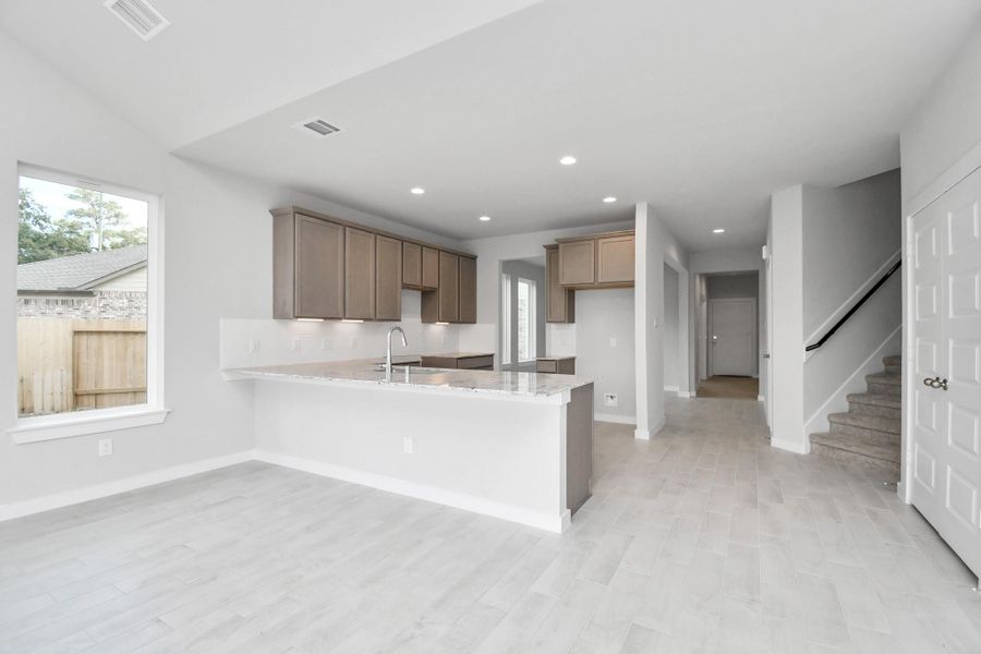 All of this overlooks your expansive family room, creating a perfect space for culinary delights and family gatherings. All of this overlooks your expansive family room, creating a perfect space for culinary delights and family gatherings.