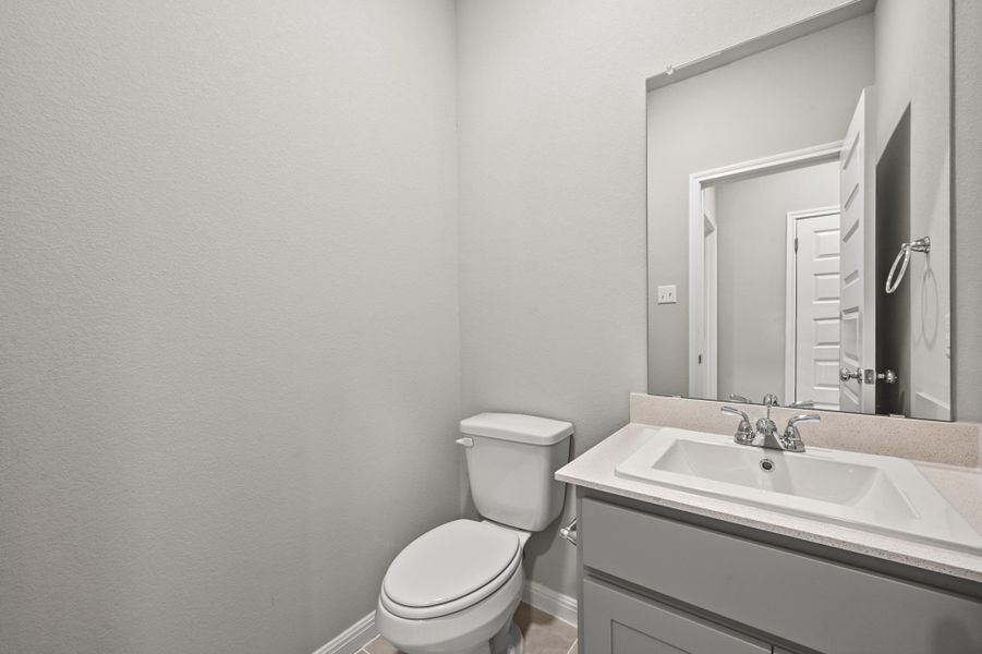 Half Bath in the Willow home plan by Trophy Signature Homes – REPRESENTATIVE PHOTO