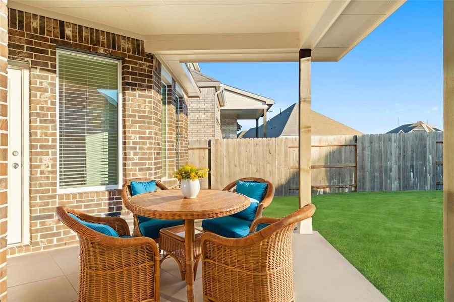 Virtually staged: The covered patio extends your living space outdoors, offering a perfect spot for morning coffee, evening relaxation, or backyard gatherings year-round. Virtually staged: The covered patio extends your living space outdoors, offering a perfect spot for morning coffee, evening relaxation, or backyard gatherings year-round.