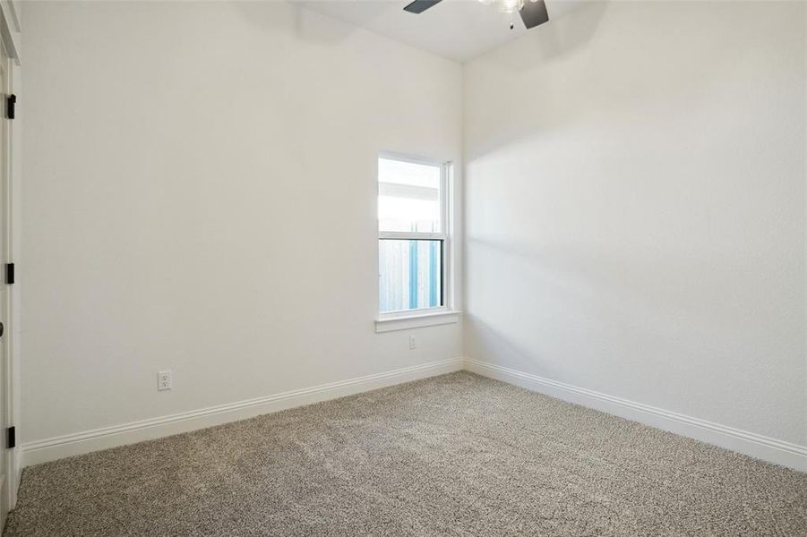 Unfurnished room with carpet floors and ceiling fan