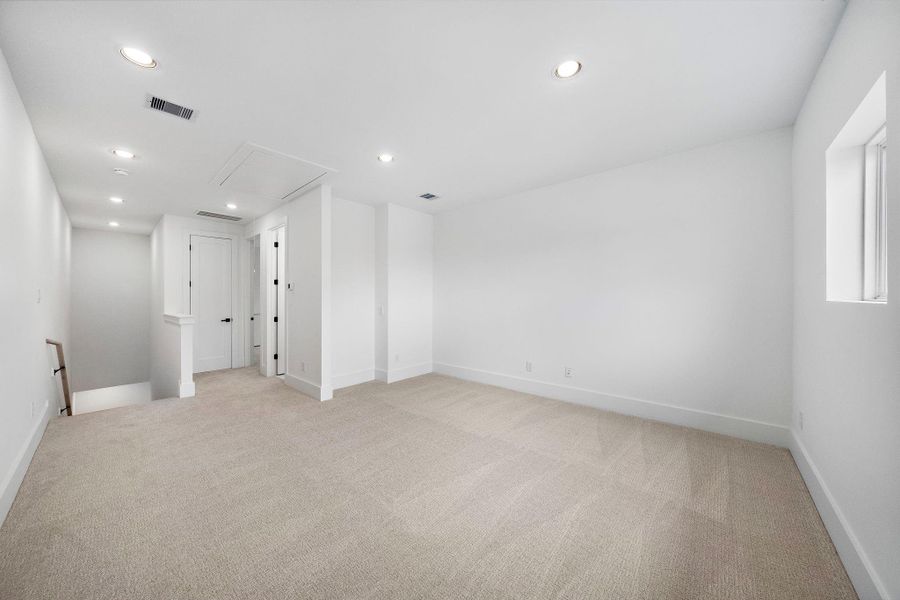 Another view of the oversized third-floor game room. (Photos are of a previously completed home. Finishes are subject to change.) Another view of the oversized third-floor game room. (Photos are of a previously completed home. Finishes are subject to change.)