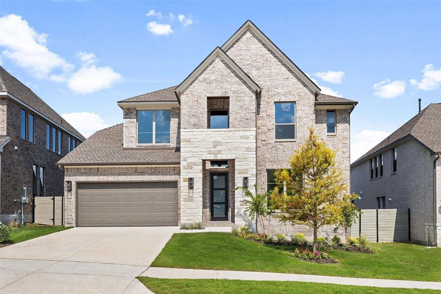 View of front of home featuring a shingled roof, brick siding, a garage, and driveway View of front of home featuring a shingled roof, brick siding, a garage, and driveway
