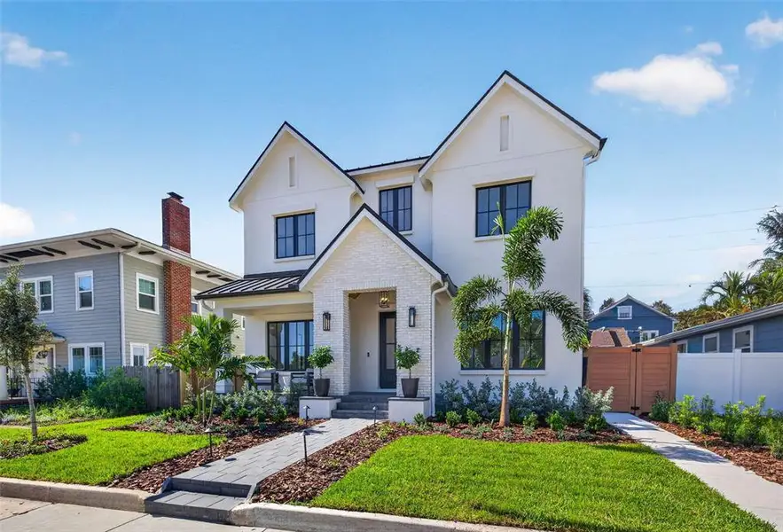 Front exterior of a new home in , St. Petersburg, FL, highlighting curb appeal (Image 27). Front exterior of a new home in , St. Petersburg, FL, highlighting curb appeal (Image 27).