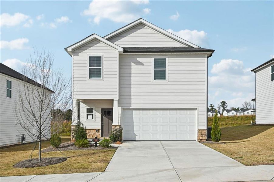Front exterior of a new home in Avalon - Reserve Series, Conyers, GA, highlighting curb appeal (Image 1). Front exterior of a new home in Avalon - Reserve Series, Conyers, GA, highlighting curb appeal (Image 1).