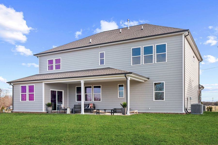 A house with a lawn in front.