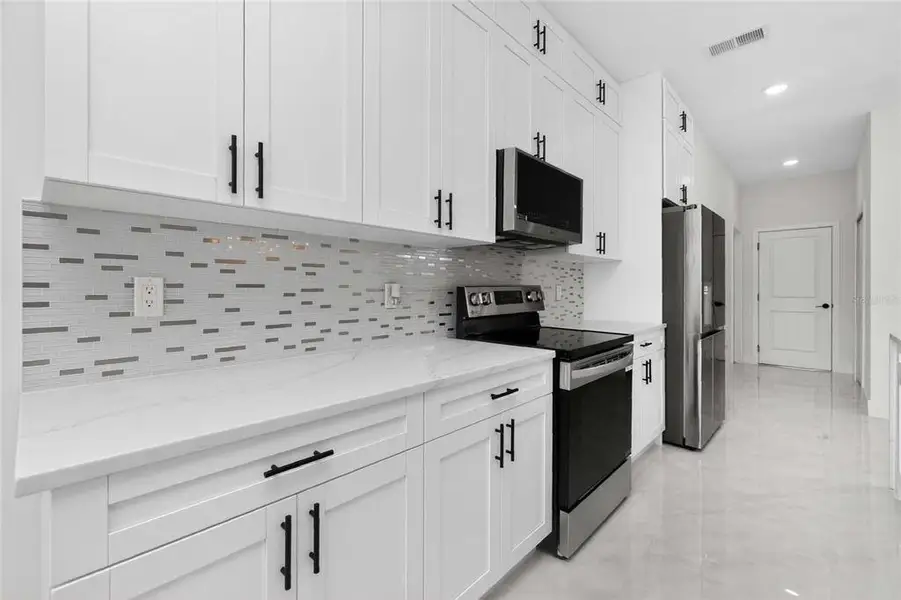 Furnished interior view inside a new home in , Port Charlotte (Image 5).