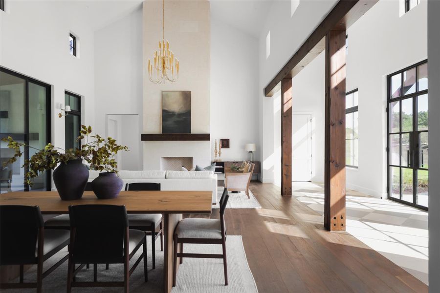 Timeless Texas materials. The living room’s focal point is a stunning limestone-surround fireplace, reflecting a classic Hill Country aesthetic. It’s a functional piece that adds texture and warmth to the modern architectural lines of the home.