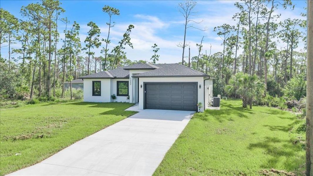 Front exterior of a new home in , Port Charlotte, FL, highlighting curb appeal (Image 23). Front exterior of a new home in , Port Charlotte, FL, highlighting curb appeal (Image 23).