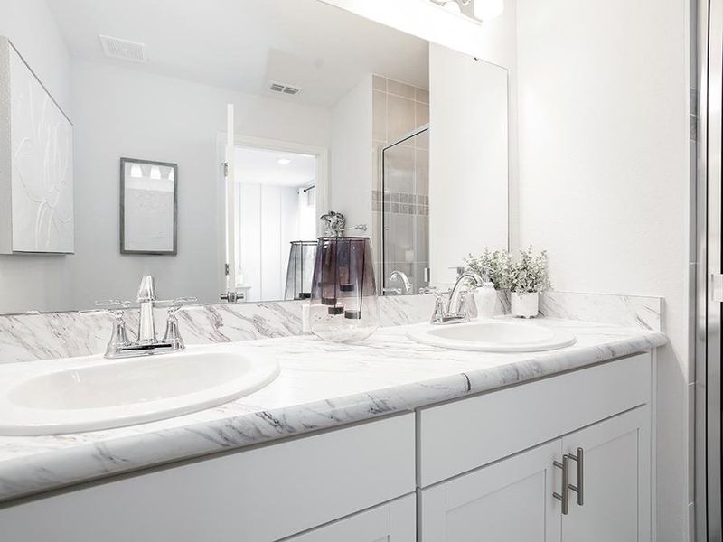 Your suite is complete with a private en-suite bath and a walk-in wardrobe - Azalea townhome by Highland Homes