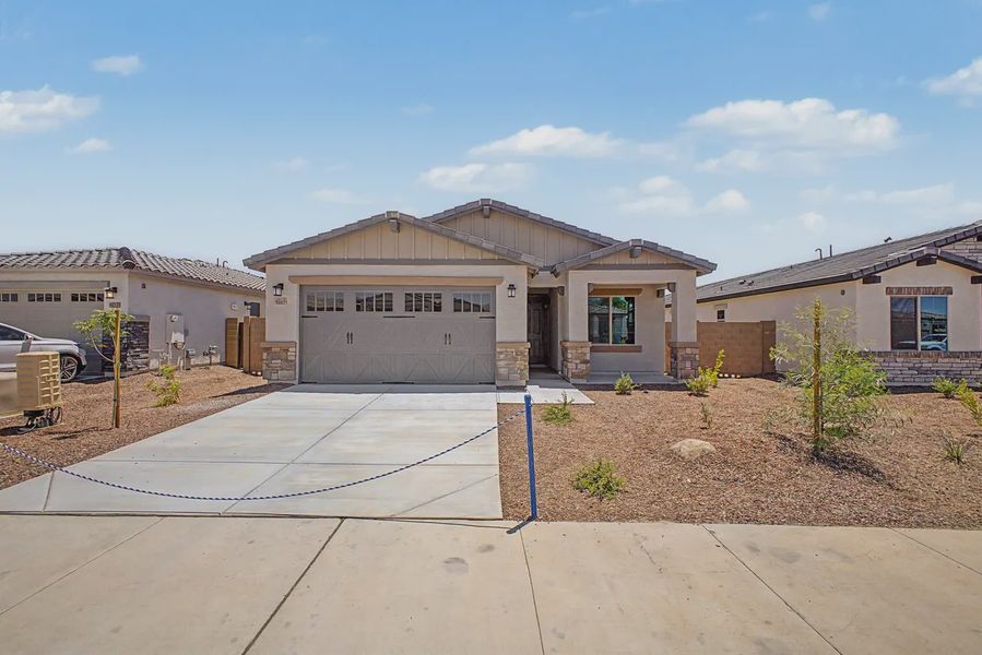 Front exterior of a new home in Avanti at Granite Vista, Waddell, AZ, highlighting curb appeal (Image 20).