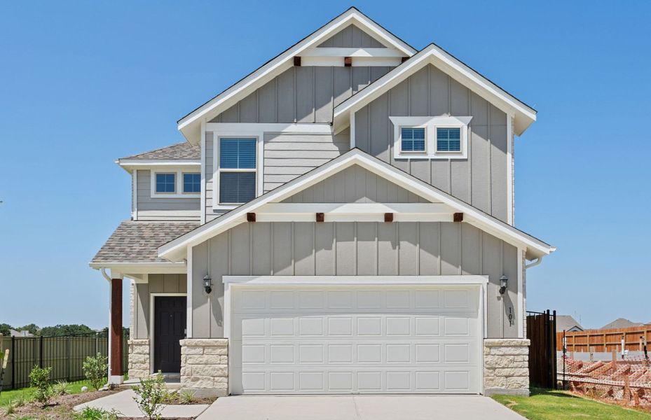 Front exterior of a new home in Santa Rita Ranch, Liberty Hill, TX, highlighting curb appeal (Image 21).