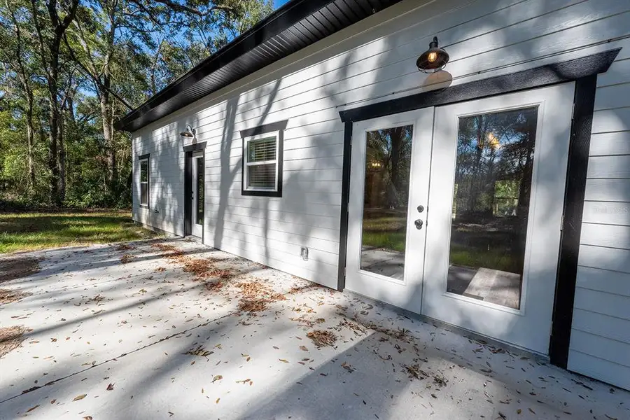 Exterior details and patio area of a home in , Bell (Image 3).