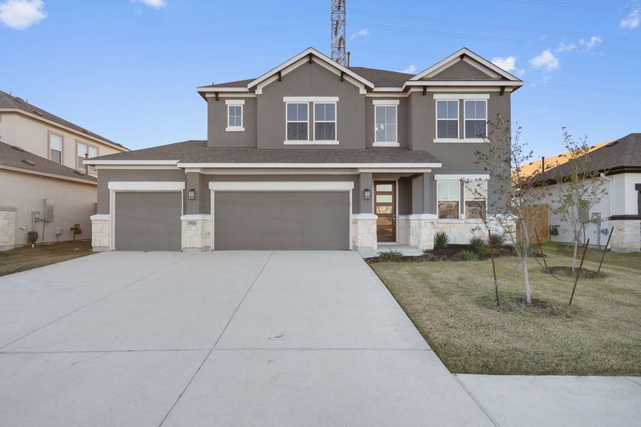Representative exterior photo of a completed home built from the Trenton 2885 MR 3CG by Saratoga Homes in Enclave at Cele, Pflugerville, TX (Image 1).