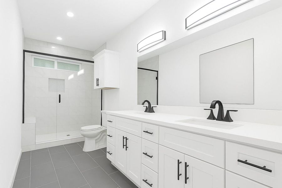 Discover luxury in this primary bathroom featuring an expansive, modern shower for a spa-like experience. Discover luxury in this primary bathroom featuring an expansive, modern shower for a spa-like experience.