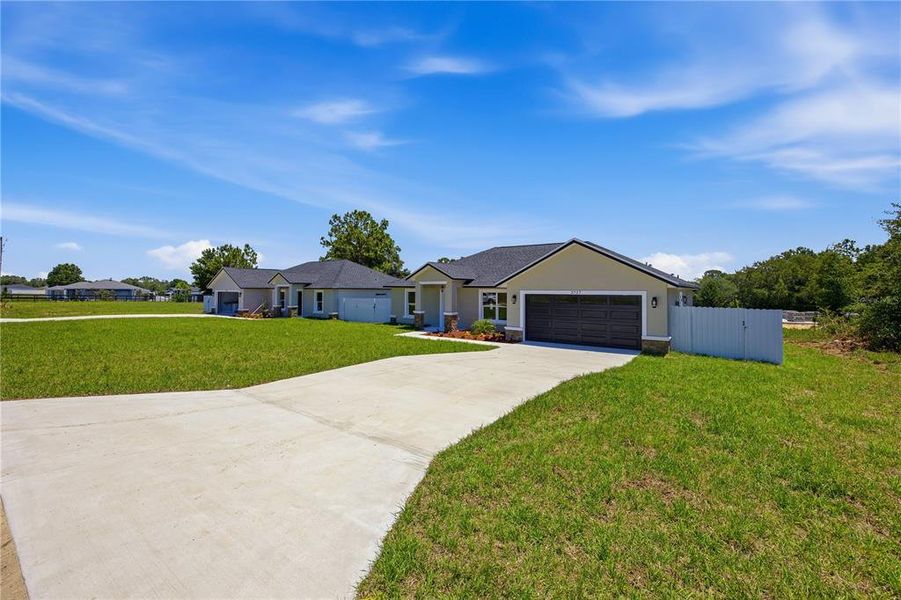 Front exterior of a new home in , Ocala, FL, highlighting curb appeal (Image 20).