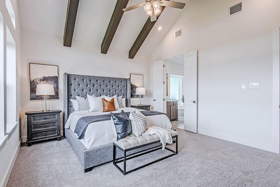 A second look at the serene primary suite showcases its generous size, architectural details, and direct access to the spa-like bath beyond double doors. A second look at the serene primary suite showcases its generous size, architectural details, and direct access to the spa-like bath beyond double doors.