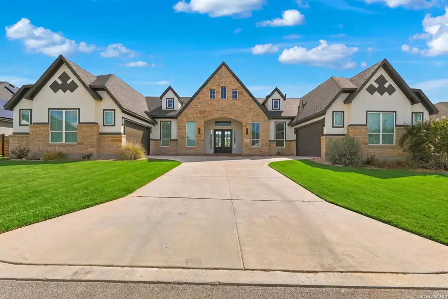 Front exterior of a new home in Potranco Oaks 100's, Castroville, TX, highlighting curb appeal (Image 1). Front exterior of a new home in Potranco Oaks 100's, Castroville, TX, highlighting curb appeal (Image 1).