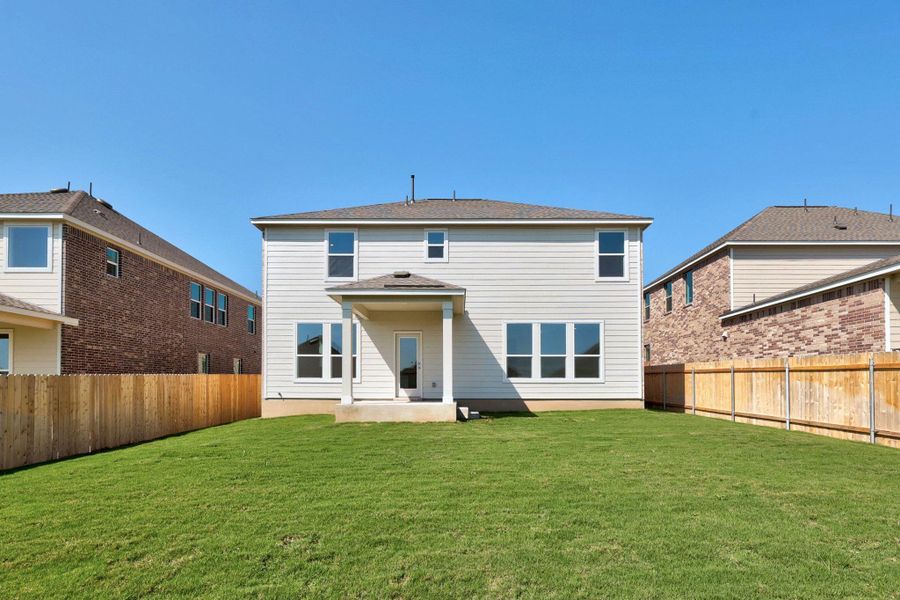 Front exterior of a new home in Salerno - Classic Collection, Round Rock, TX, highlighting curb appeal (Image 20). Front exterior of a new home in Salerno - Classic Collection, Round Rock, TX, highlighting curb appeal (Image 20).