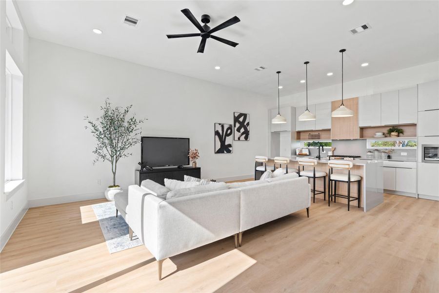 A palette of warm woods & soft light brings a sense of cohesion to this open, modern living space. A palette of warm woods & soft light brings a sense of cohesion to this open, modern living space.