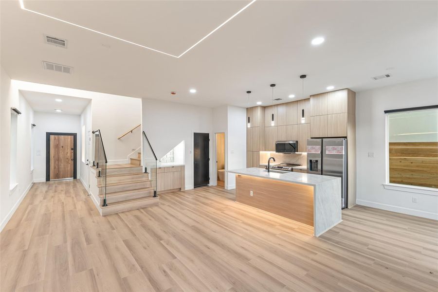 Wide entrance leading into living room and kitchen area.