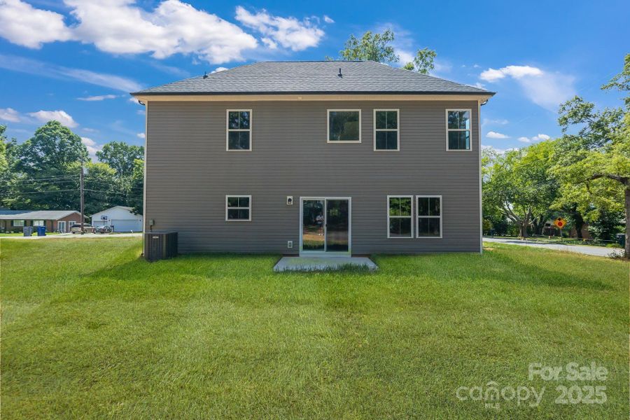Front exterior of a new home in , Harrisburg, NC, highlighting curb appeal (Image 1).