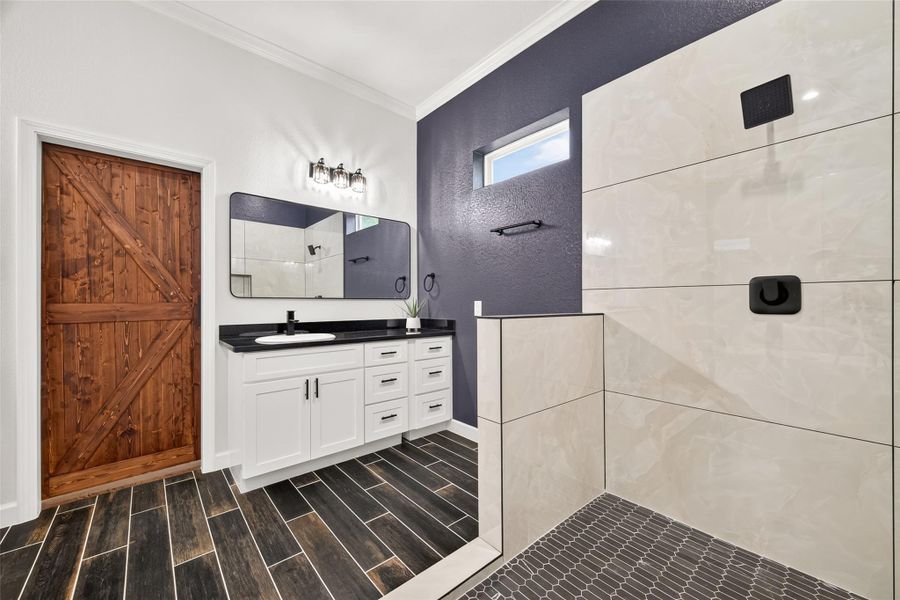Beautifully appointed primary bathroom with modern finishes and generous space.