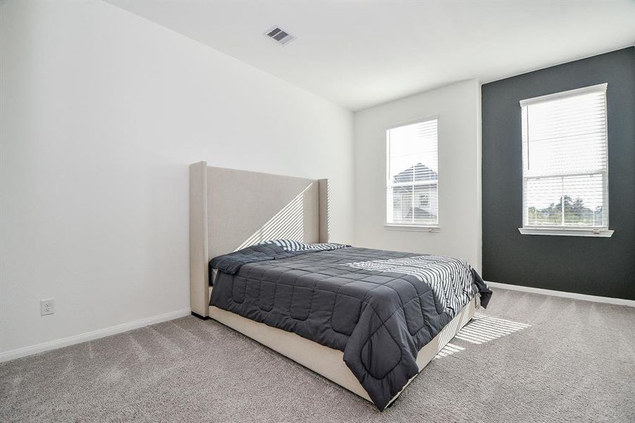 You will have sweet dreams in this posh owner's retreat. This spacious suite offers plush carpet, designer and neutral paint, a large walk-in closet and a beautiful ensuite bathroom.