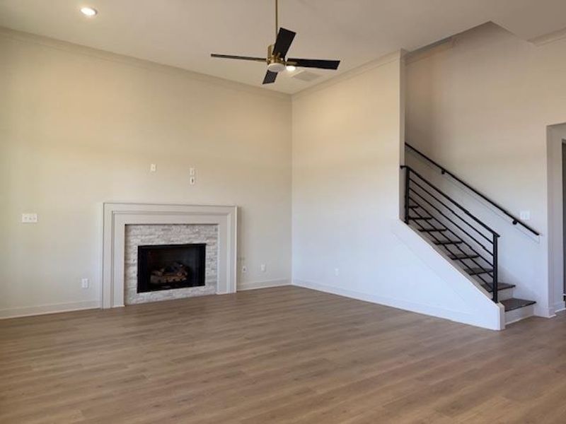 Features high ceilings, flush mounted recessed lighting, ceiling fan, and ventless gas fireplace.