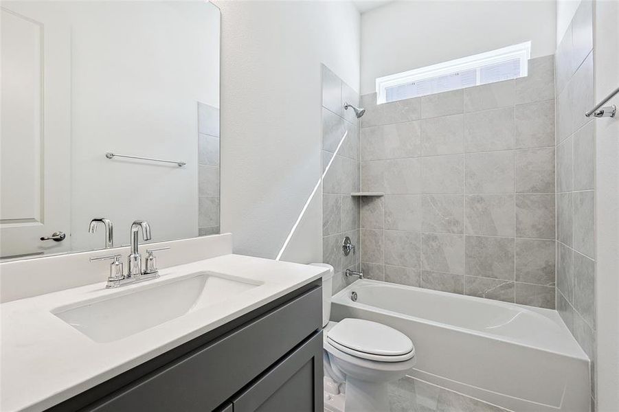 Full bath featuring shower / washtub combination and vanity Full bath featuring shower / washtub combination and vanity
