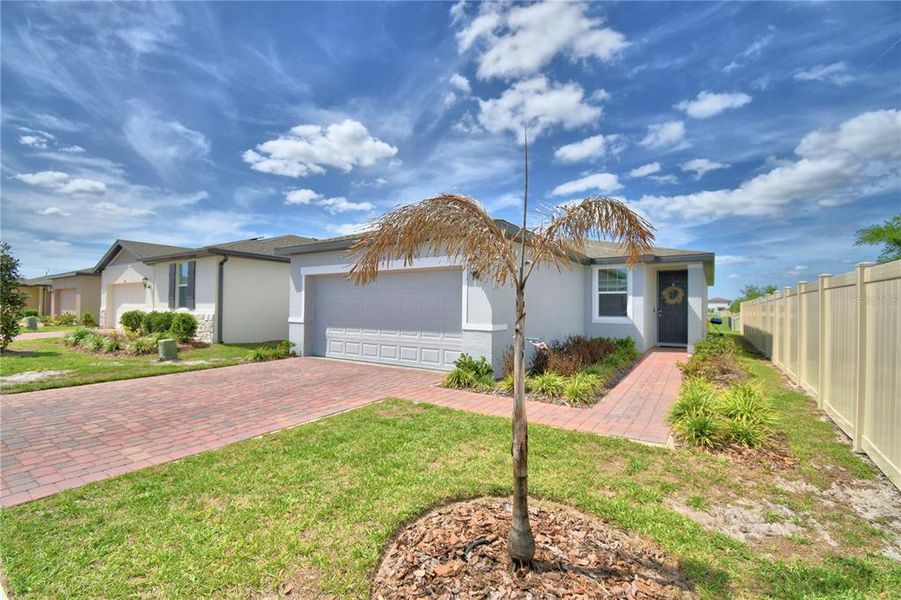 Front exterior of a new home in Lake Deer Estates - Classic Series, Kissimmee, FL, highlighting curb appeal (Image 24).