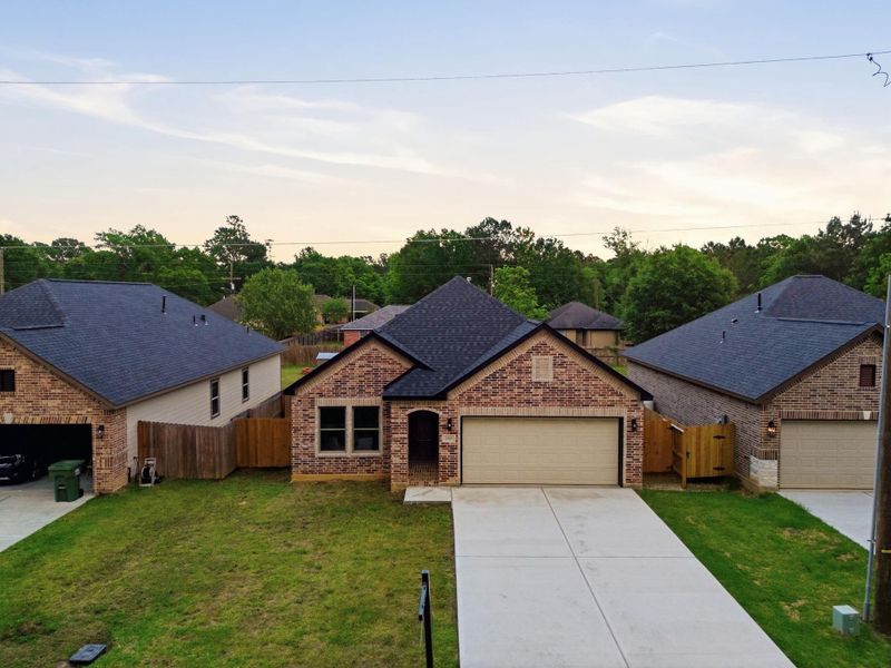 Front exterior of a new home in , Cleveland, TX, highlighting curb appeal (Image 25).