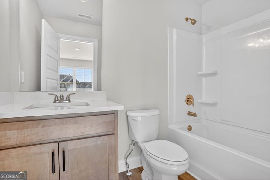 Furnished interior view inside a new home in Stone Brooke, Gray (Image 14).
