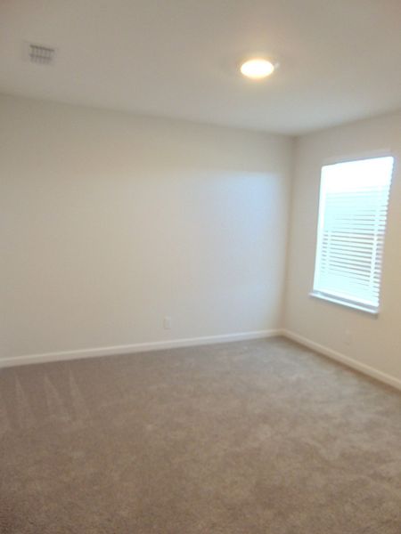 The second bedroom, which is located on the second floor