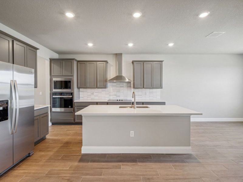 Kitchen in the Onyx floorplan at 6406 NW Sweetwood Drive