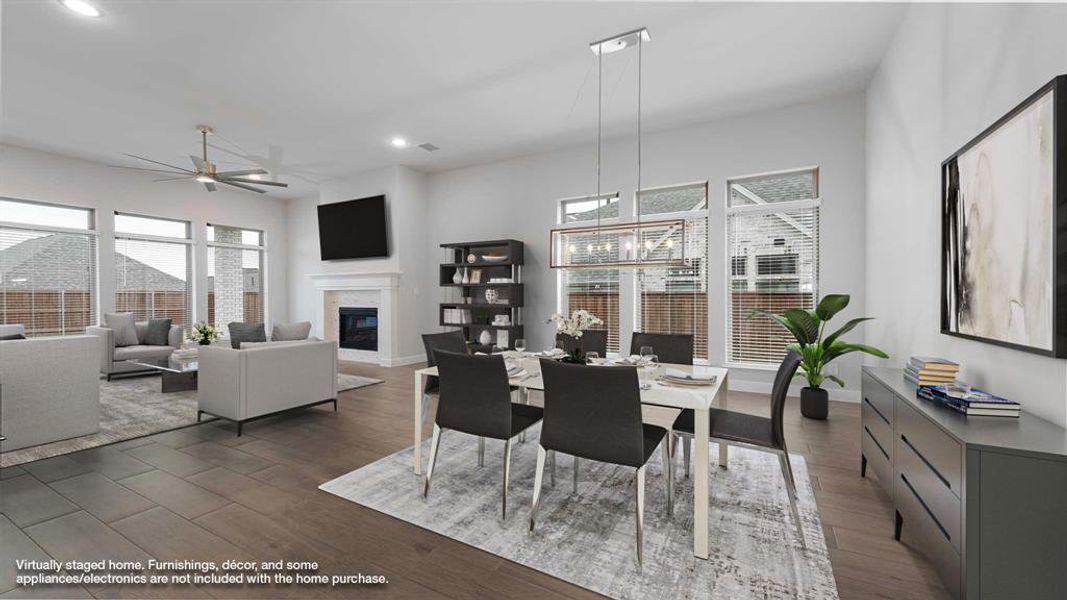 Dining room with ceiling fan and dark hardwood / wood-style floors